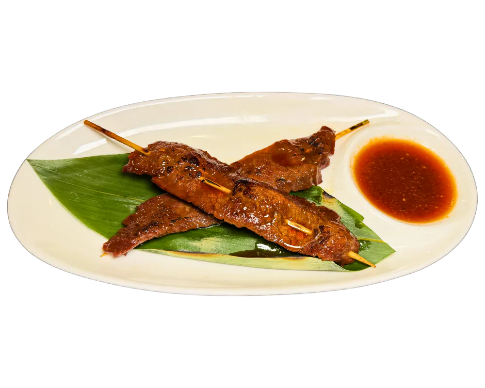 Marinated grilled beef skewers with dipping sauce at SOHO Asian Fusion, a Asian Fusion Restaurant in Austin.
