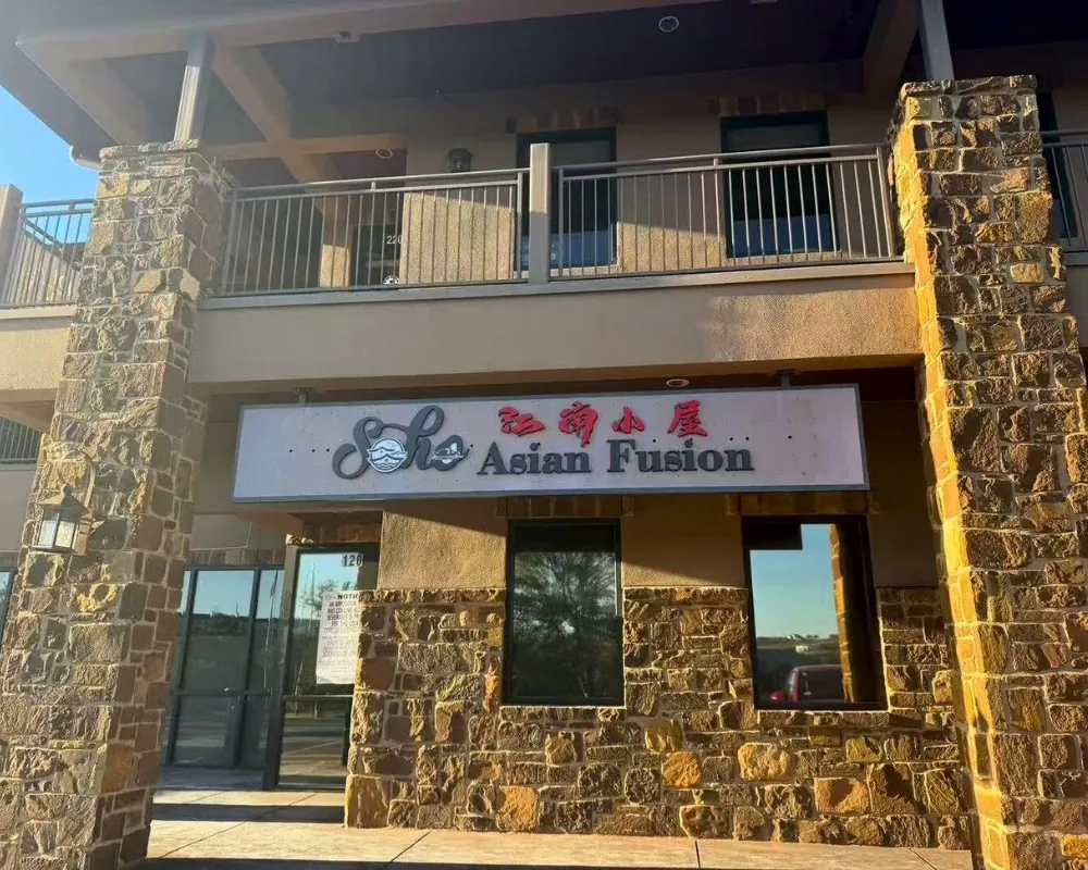 Main entrance with bilingual signage at SOHO Asian Fusion, a Asian Fusion Restaurant in Austin.